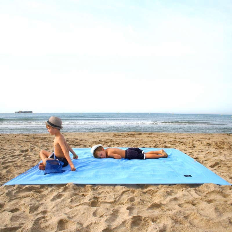 Drap de plage obaba sable epuisette vague mer